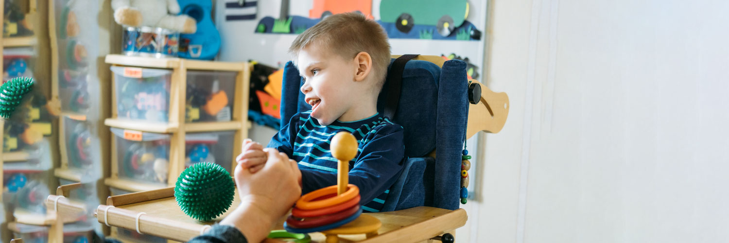 young special needs boy works on sensory and occupational therapy All for Kids Home Health Colorado
